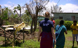 AusAID rapid response team member Mel Powell surveying damage in Latoka, Fiji, after Cyclone Evan