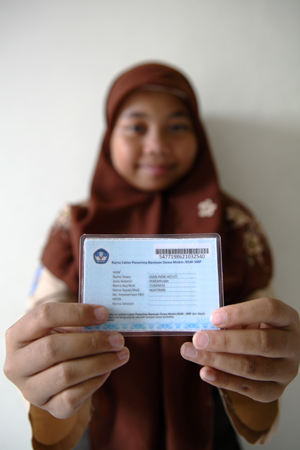 Girl holding an ID card