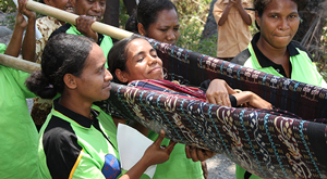 Pregnant lady carried on a stretcher