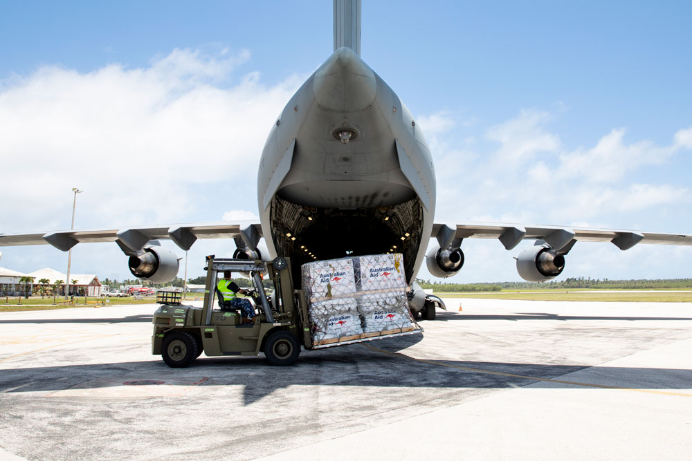 Emergency relief supplies being unloaded from a RAAF aircraft at Fua’amotu International Airport, Tonga. 