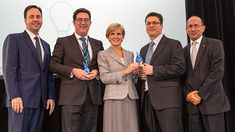 The judges handing an trophy to a winner