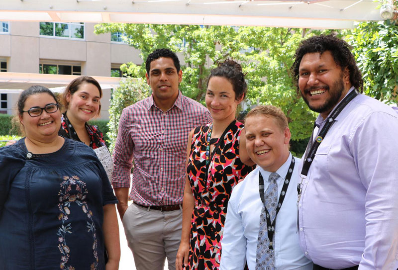 Group photo of Indigenous Employee Network members at a BBQ for National Apology Day.