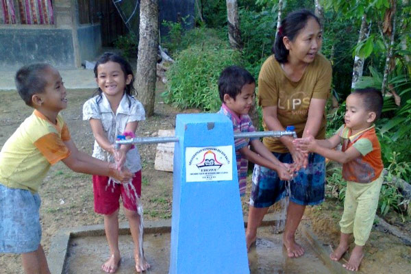 Children washing their hands