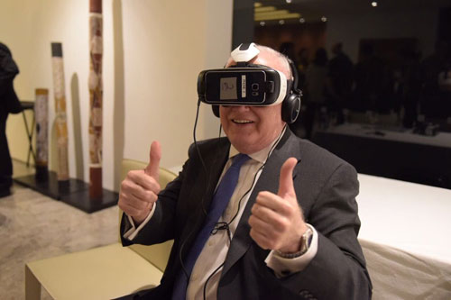 HE Ambassador Mr Gary Quinlan AO trying out enVizion’s technology headset that covers your eyes.