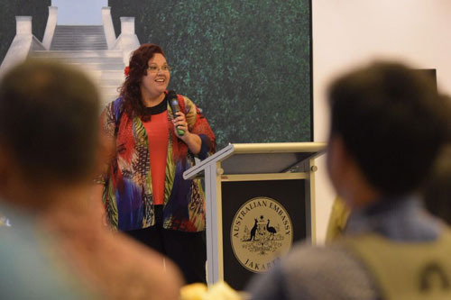 Julie-Ann Lambourne speaking to an audience behind a lectern.