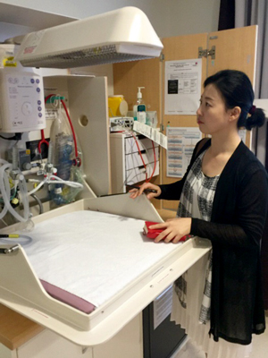 A Korean journalist looks at medical equipment at the Royal Women’s Hospital in Melbourne