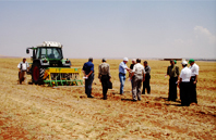 Photo of a group of people on a crop field