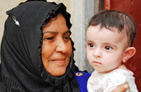 Photo of woman carry a boy