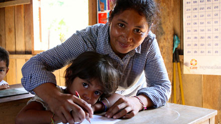 Graphic of a girl writing and being helped by a woman