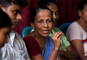 Sri Lankan women participating in a community meeting