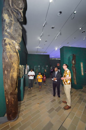 Crispin Howarth, the National Gallery of Australia's curator of Pacific art, shows Vanuatu High Commissioner Kalfau Kaloris through the Kastom exhibition