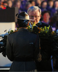 Photo of Australian Foreign Minister Mr Kevin Rudd accepting a wreath from a soldier