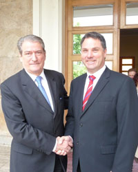 Photo of Parliamentary Secretary for Foreign Affairs Richard Marles shaking hands on a visit to Albania