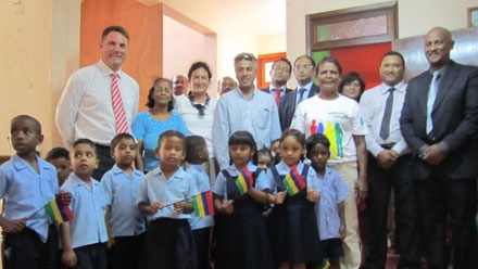 Parliamentary Secretary Marles with Australia's High Commissioner to Mauritius, Sandra Vegting, Mauritian Foreign Minister Arvin Boolell, Director of L'Atelier Sa Nou Vize, Alain Auriant, and children at a ceremony to hand over educational materials to L'Atelier Sa Nous Vize in Rose Belle.