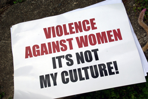 A sign that says 'Violence against women. Its not my culture' 
