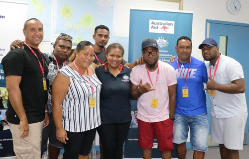 Mayor of the Torres Strait Regional Council posing for photo with a group of people.