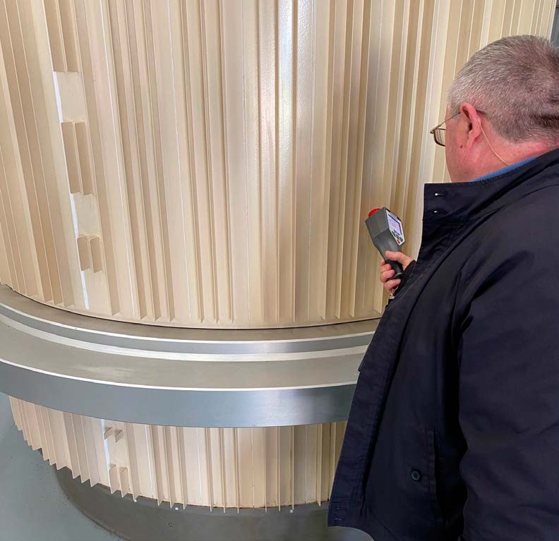 IAEA inspector examining TN81 cask containing HIFAR radioactive waste during Complementary Access at ANSTO in June 2020 (Credit: ANSTO).