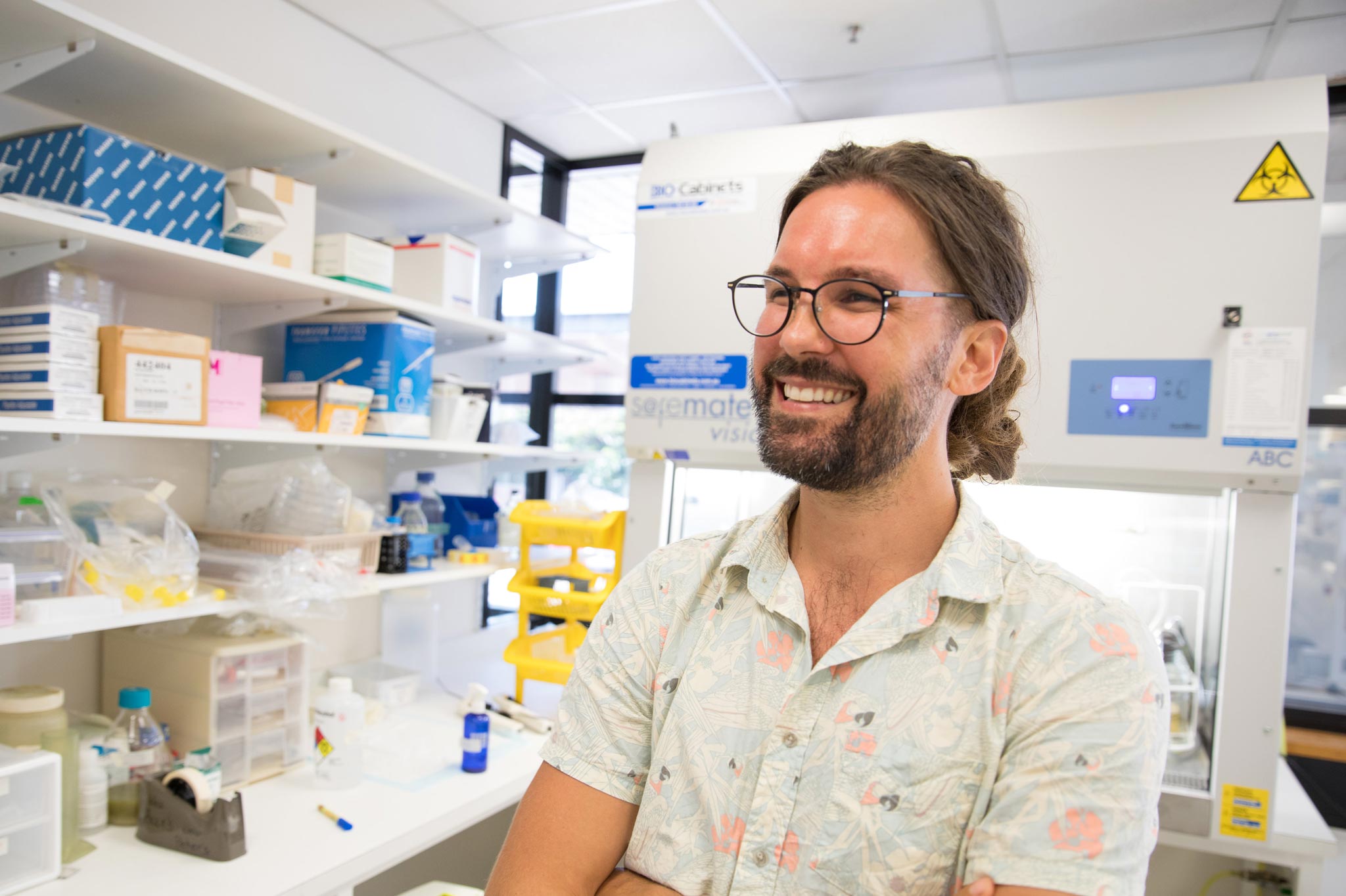 Profile photo of Matthew Grigg smiling, in a lab