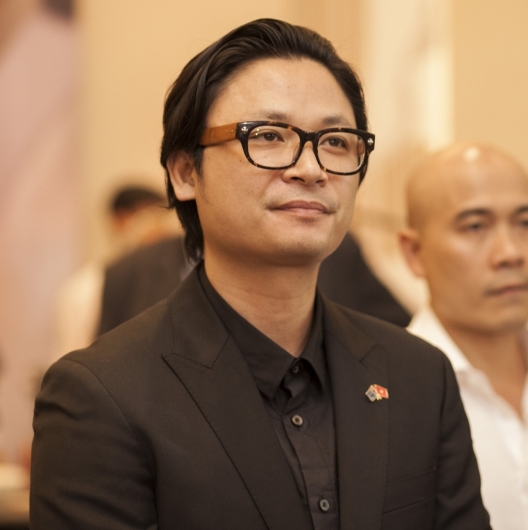Luke Nguyen headshot, listening, with another man to his left