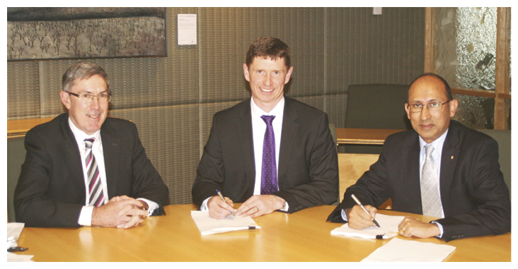 Secretary Peter Varghese AO (right) and Chief Financial Officer Paul Wood (centre), with Deputy Secretary Ewen McDonald, signing the department’s financial statements for the year ended 30 June 2014, Canberra, 19 September 2014. [DFAT]
