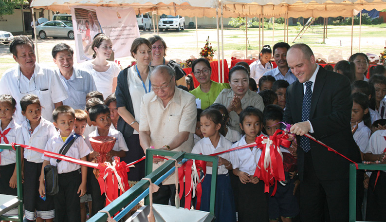 Ambassador to Laos, John Williams (right), and Vice Minister of Education and Sports, Mr Lytou Bouapao, open an Australian aid-funded, UNICEF project, providing new water, sanitation and hygiene facilities, Viengkeo Primary School, Vientiane, 3 June 2014