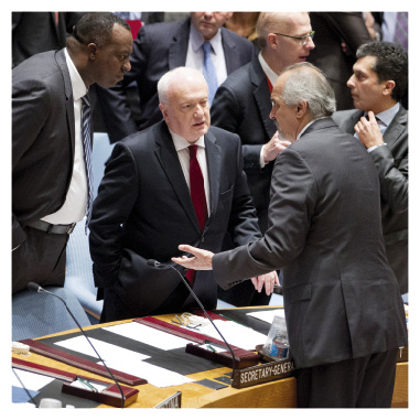 Permanent Representative to the United Nations and then President of the Security Council, Gary Quinlan (centre), and the Rwandan Permanent Representative (left) with the Syrian Arab Republic Permanent Representative before the UNSC vote on safeguarding and destroying Syria’s chemical weapons stockpiles, New York, 17 September 2013