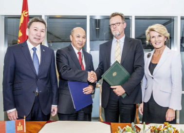 First Assistant Secretary Consular and Crisis Management Division, Justin Brown (second right), and Mongolian Ambassador, Ravdan Bold (second left), are joined by Foreign Minister Julie Bishop and Mongolian Foreign Minister, Luvsanvandan Bold (left), after signing an MOU on Consular Cooperation, Canberra, 18 March 2014. [DFAT]