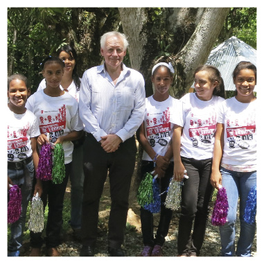 Ambassador to Mexico, Tim George, with children from communities along the Dominican–Haitian border, recipients of the embassy’s DAP project, coordinated with the NGO Save the Children Dominican Republic, to support the production of plants, reforestation and community rehabilitation, 28 June 2014. [DFAT]