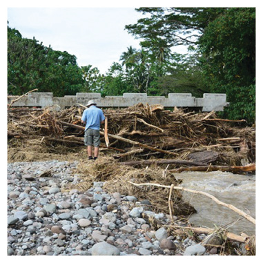 Australian Civilian Corp engineering specialist Keith Swann assesses damage to infrastructure from devastating floods in Solomon Islands, April 2014. [Keith Swann]