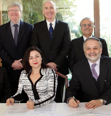 Ambassador to Chile, Tim Kane (back centre), joins University of Queensland Deputy Vice-Chancellor (International), Professor Monique Skidmore, and Vice President of Chile’s Production Development Corporation, Dr Eduardo Bitran, as they sign an agreement on an International Centre of Excellence in Sustainable Mining, Santiago, June 2014. The embassy worked closely with the University of Queensland, Chile’s University of Concepcion and the Chilean Government to finalise the agreement. [DFAT]