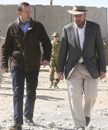 Provincial Reconstruction Team (PRT) Director, David Windsor, with Prime Minister Abbott, Tarin Kowt, 28 October 2013. [DFAT]