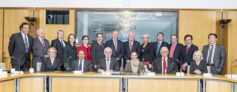 Secretary, Peter Varghese AO (seated: second left), with Minister for Trade and Investment, Andrew Robb AO (seated: third left), with officials, academics and business leaders at the first TIPAC meeting, Canberra, 6 June 2014. [AUSPIC/Howard Moffatt]