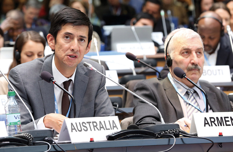 Ambassador for Climate Change, Dr Justin Lee (left), addresses the opening plenary of UNFCCC Ad Hoc Working Group on the Durban Platform for Enhanced Action session, Bonn, March 2014. [IISD/Earth Negotiations Bulletin]