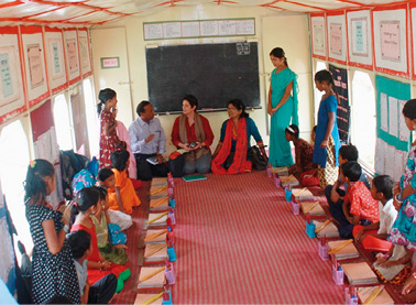 Counsellor (Development Cooperation) in Dacca, Priya Powell (back, second left), visits a DAP-funded boat school, bringing education to children in inaccessible areas, Sylhet district, Bangladesh, April 2014. [DFAT]