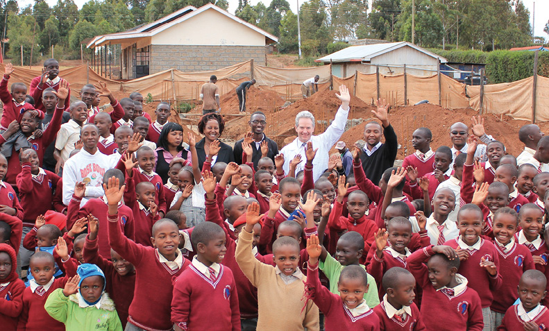 High Commissioner to Kenya, Geoff Tooth, with students and teachers from Immanuel Afrika Academy after laying the foundations for the construction of eight new DAP-funded classrooms, Nairobi, 20 November 2013. [DFAT]