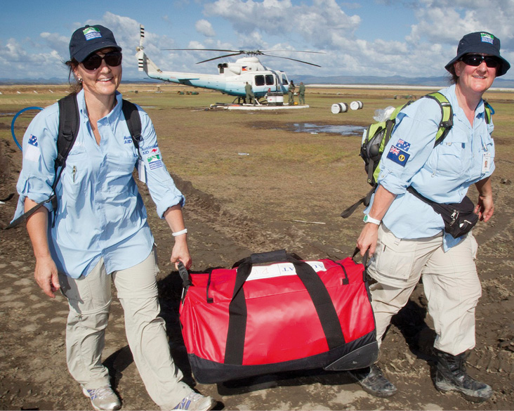 AUSMAT officers, Wendy Rogers – operating nurse Royal Darwin Hospital (left), and Tracy Callan – paramedic South Australia, arrive to assist in the relief efforts following Typhoon Haiyan, Philippines, 15 November 2013. [DFAT]