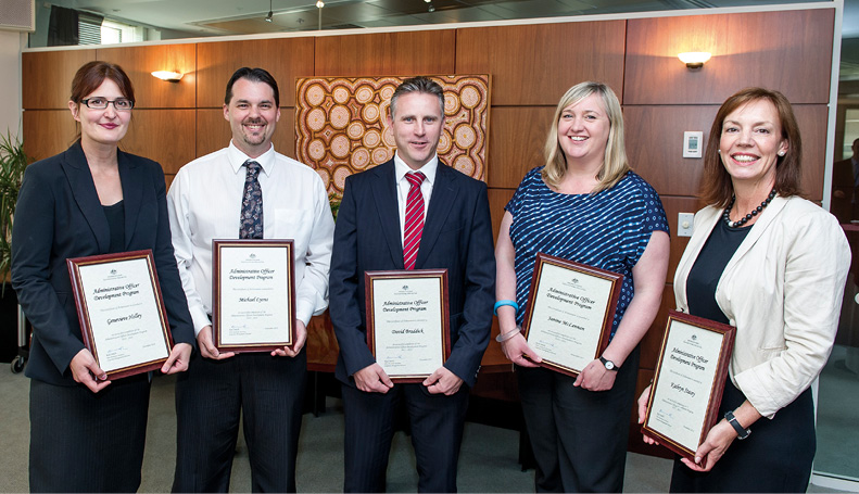 2011–12 Administrative Development Program participants complete the two-year program, Canberra, 20 November 2013. Left to right: Genevieve Holley, Michael Lyons, David Braddick, Janine McLennan and Kathryn Stacey. [AUSPIC/Howard Moffat]