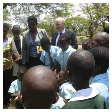 Ambassador to Zimbabwe, Matthew Neuhaus, with school children and teachers, beneficiaries of the embassy-funded project that provided books to six library centres, Harare, 29 November 2013. [DFAT]