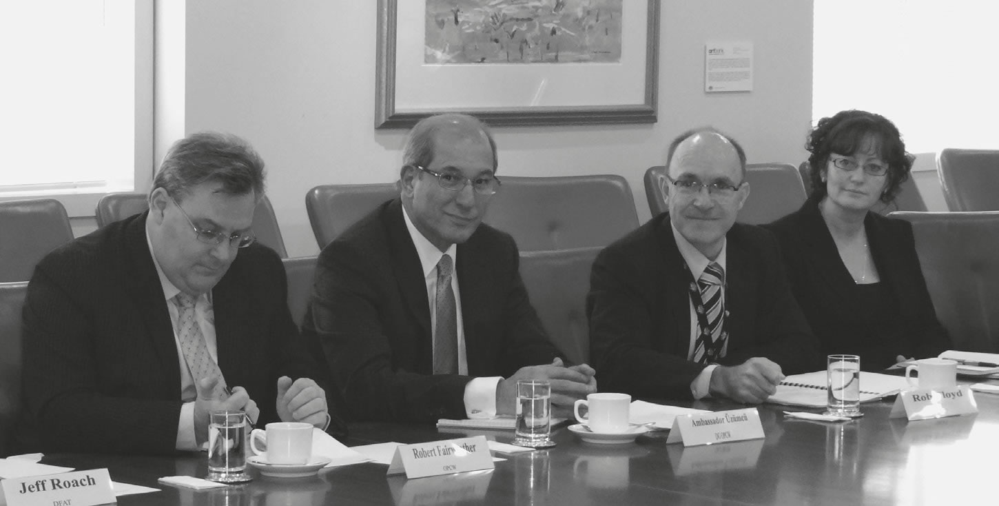 OPCW Director-General Ahmet Üzümcü and ASNO Director General Robert Floyd with ASNO and DFAT staff at a meeting held during Mr Üzümcü's visit to Australia, July 2012