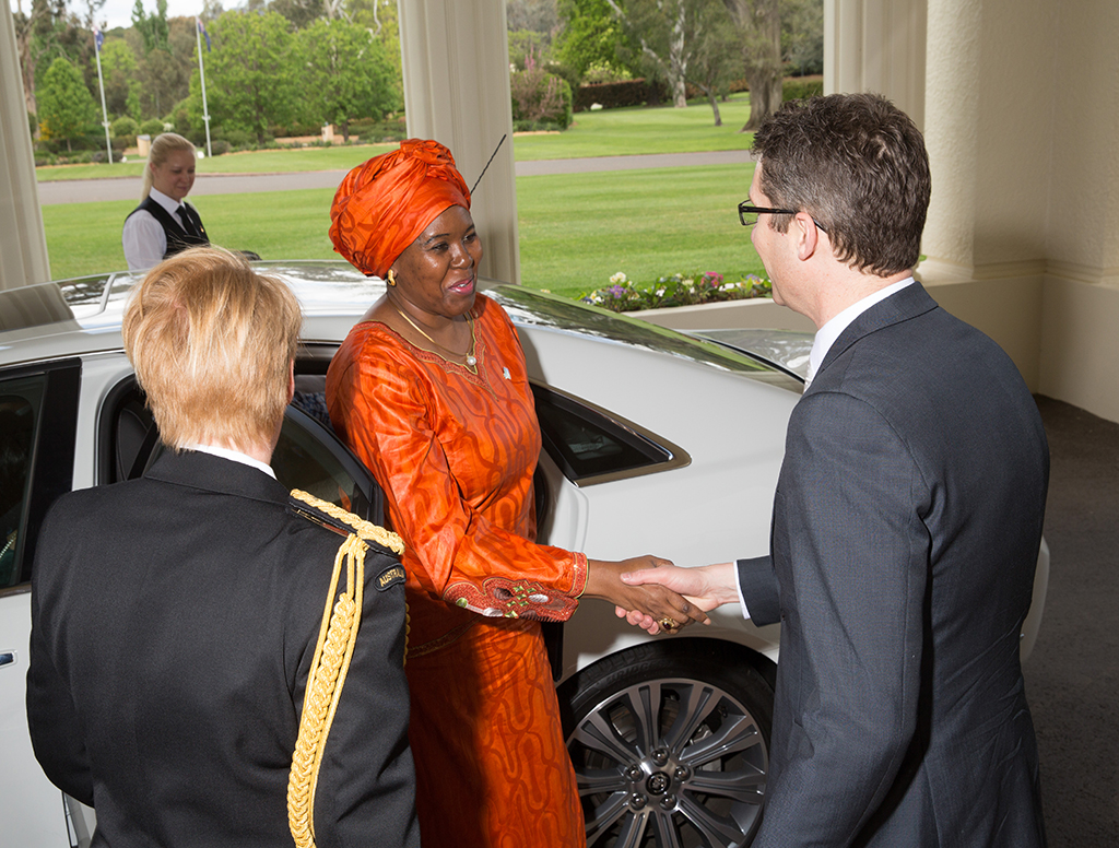 Then Chief of Protocol Chris Cannan greets non-resident High Commissioner for the United Republic of Tanzania on arrival at Government House to present her Letter of Commission to the Governor-General. [DFAT/Andrew Taylor]