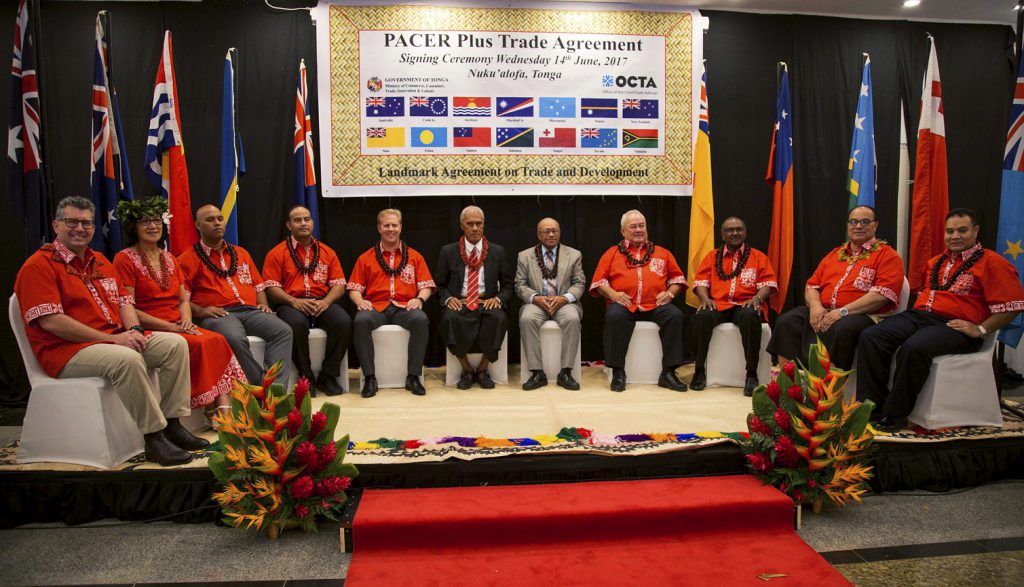 Assistant Minister for Trade, Tourism and Investment Keith Pitt with Tongan Prime Minister Akilisi Pohiva and representatives of the other member countries at the PACER Plus signing ceremony. [DFAT/Ana Kolokihakaufisi]