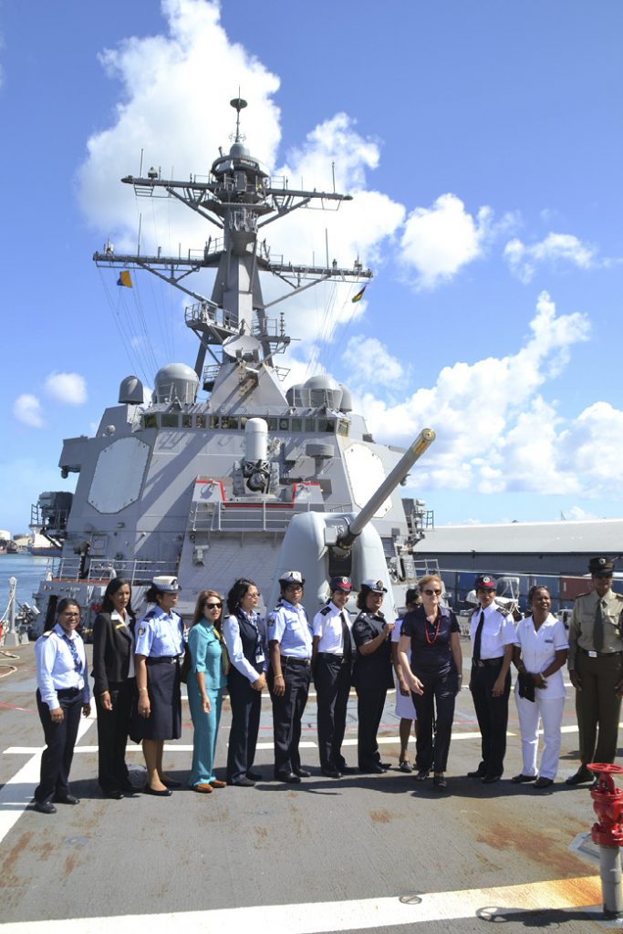 High Commissioner Mauritius Susan Coles, Deputy High Commissioner Lorena Lopez de Herd and the local ‘Women in Uniform’ Committee undertaking a shipboard tour of the USS Cole. [DFAT/Yasmin Hosanoo]