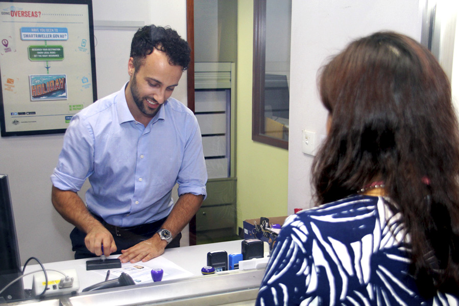 Consul Steve Hodge providing notarial services at the Australian Consulate-General, Hong Kong. [DFAT/Gavin McDougall]
