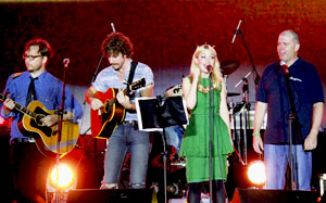 Photo of AusAID Minister-Counsellor, Mekong and Regional, Michael Wilson joined Kate Miller Heidke and a band performing on stage