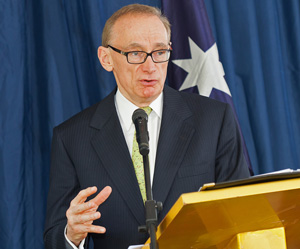 Mr Carr speaking into microphone