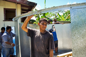 Men building a large water tank
