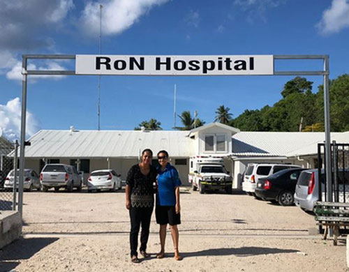 Two women posing for photo outside RoN Hospital