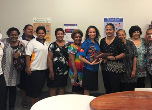 Group of people posing for photo with Venessa.