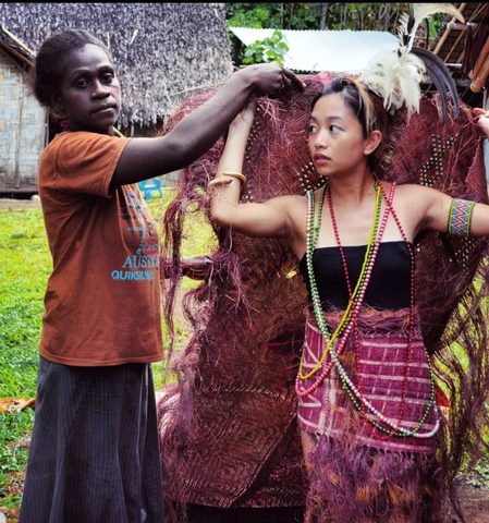 Maria with a local villager practicing culture.