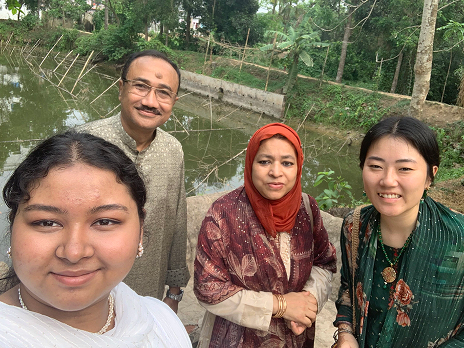 Jasmine with three members of her host family.